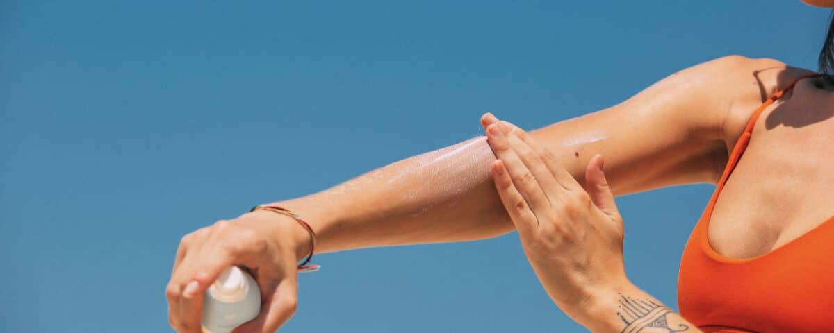 person applying mineral sunscreen